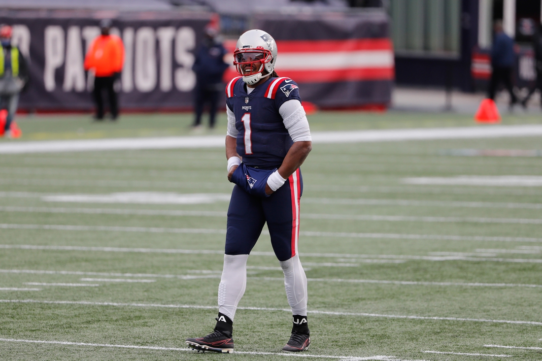 Jan 3, 2021; Foxborough, Massachusetts, USA; New England Patriots quarterback Cam Newton smiles against the New York Jets during the first half at Gillette Stadium. Mandatory Credit: Winslow Townson-USA TODAY Sports