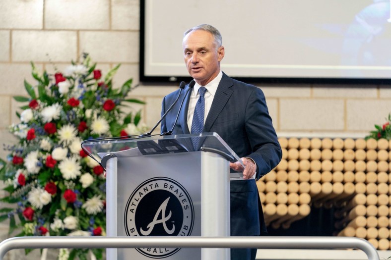 Jan 26, 2021; Atlanta, GA, USA; MLB Commissioner Rob Manfred speaks during "A Celebration of Henry Louis Aaron," a memorial service celebrating the life and enduring legacy of the late Hall of Famer and American icon, on Tuesday, Jan. 26, 2021 at Truist Park in Atlanta. Mandatory Credit: Kevin D. Liles/Pool Photo-USA TODAY Sports