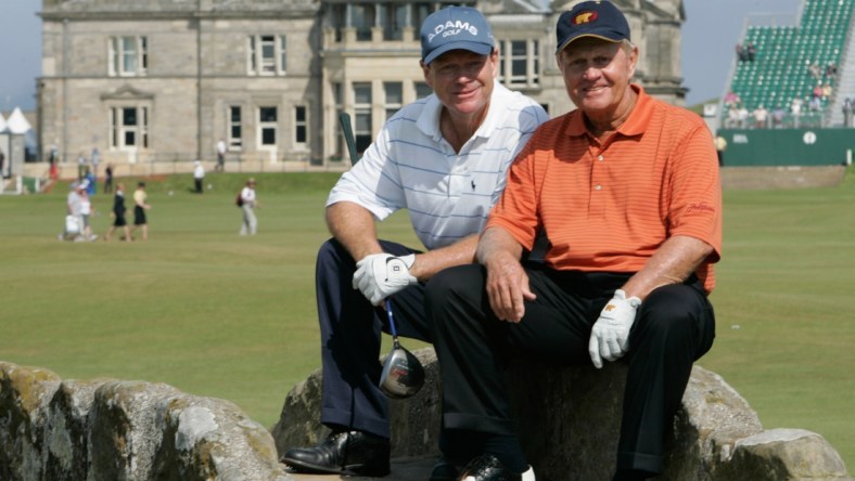 July 12, 2005; St. Andrews, Scotland; British Open practice -- British Open practice round partners Tom Watson and Jack Nicklaus pause to pose for for photographs on the Swilcan Bridge at St. Andrews.  Nicklaus has said this will be his last British Open and last major tournament. Mandatory Credit: H. Darr Beiser/USA TODAY NETWORK