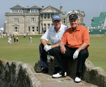 July 12, 2005; St. Andrews, Scotland; British Open practice -- British Open practice round partners Tom Watson and Jack Nicklaus pause to pose for for photographs on the Swilcan Bridge at St. Andrews.  Nicklaus has said this will be his last British Open and last major tournament. Mandatory Credit: H. Darr Beiser/USA TODAY NETWORK
