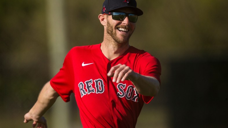 Chris Sale, a pitcher for the Boston Red Sox baseball team warms up during the first day Spring Training for the full squad at Jet Blue Park in Fort Myers on Monday, February 22, 2021. He is recovering from Tommy John surgery and is it is uncertain when he is returning.

Salesmiling