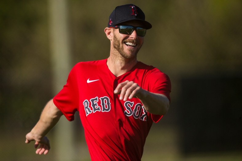 Chris Sale, a pitcher for the Boston Red Sox baseball team warms up during the first day Spring Training for the full squad at Jet Blue Park in Fort Myers on Monday, February 22, 2021. He is recovering from Tommy John surgery and is it is uncertain when he is returning.

Salesmiling