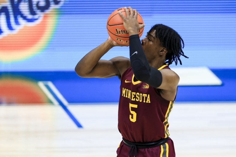 Mar 11, 2021; Indianapolis, Indiana, USA; Minnesota Golden Gophers guard Marcus Carr (5) attempts a three point basket against the Ohio State Buckeyes in the first half at Lucas Oil Stadium. Mandatory Credit: Aaron Doster-USA TODAY Sports