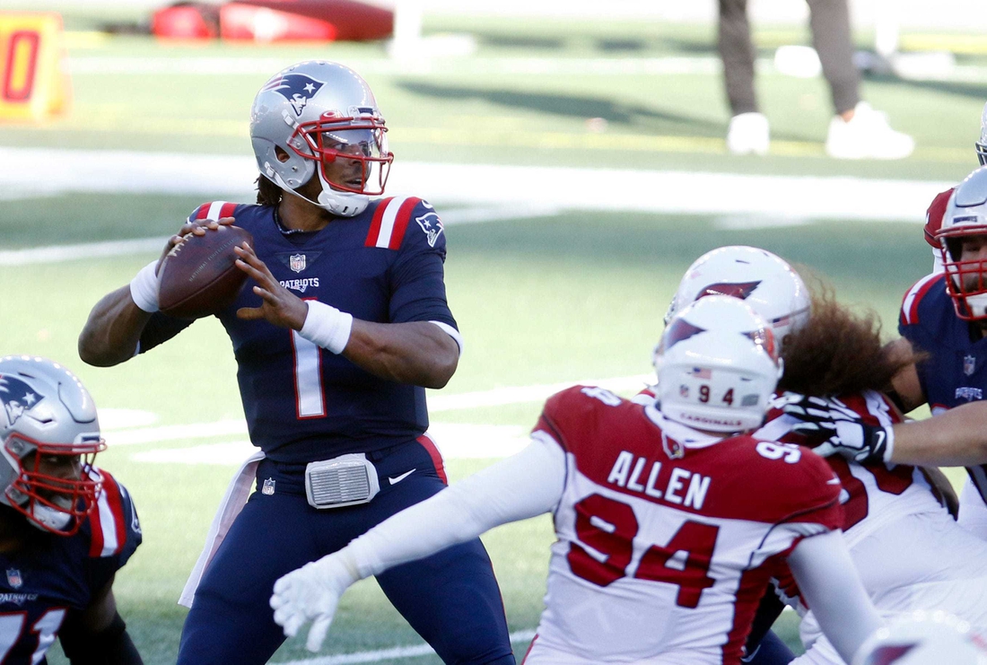 Published Caption:  Patriots quarterback Cam Newton looks for a receiver in the first half against the Arizona Cardinals on Sunday afternoon. [The Providence Journal / Kris Craig] Original Caption:  Patriots quarterback Cam Newton looks for a receiver in the first half against the Arizona Cardinals on Sunday afternoon.

LEDE 2