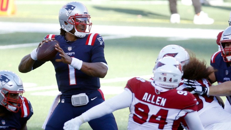 Published Caption:  Patriots quarterback Cam Newton looks for a receiver in the first half against the Arizona Cardinals on Sunday afternoon. [The Providence Journal / Kris Craig] Original Caption:  Patriots quarterback Cam Newton looks for a receiver in the first half against the Arizona Cardinals on Sunday afternoon.

LEDE 2