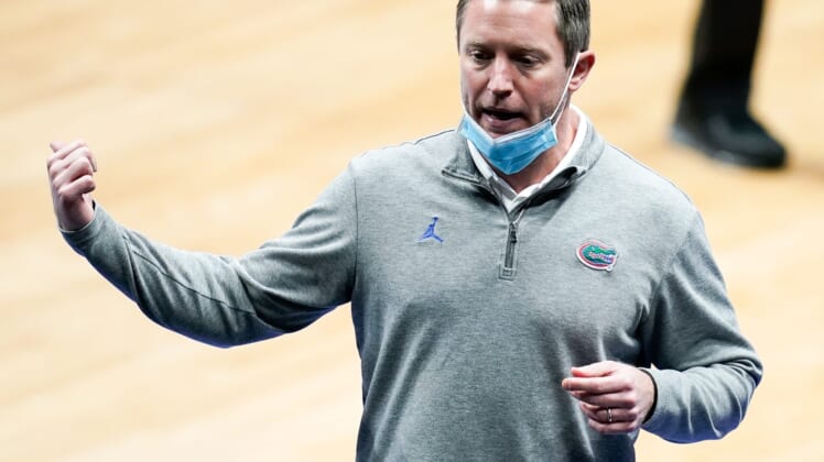 Florida head coach Mike White works with his team during the first half of the SEC Men's Basketball Tournament game against Tennessee at Bridgestone Arena in Nashville, Tenn., Friday, March 12, 2021.Ut Fla Sec 031221 An 014