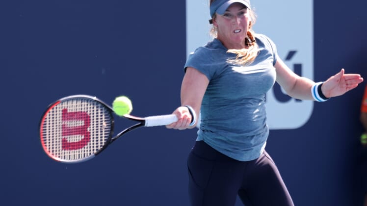 Mar 23, 2021; Miami, Florida, USA; Madison Brengle of the United States hits a forehand against Shelby Rogers of the United States (not pictured) in the first round of the Miami Open at Hard Rock Stadium. Mandatory Credit: Geoff Burke-USA TODAY Sports