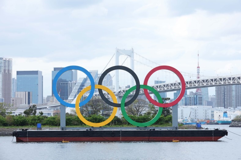 Apr 6, 2021; Tokyo, JAPAN; General view of the Olympic rings sculpture, Rainbow Bridge, and Tokyo Tower as seen from Odaiba in preparation for the Tokyo 2020 Olympic Summer Games set to begin in July 2021. Mandatory Credit: Yukihito Taguchi-USA TODAY Sports