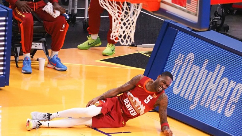 Apr 23, 2021; San Francisco, California, USA; Denver Nuggets guard Will Barton (5) lays on the court with an injury during the first quarter against the Golden State Warriors at Chase Center. Mandatory Credit: Kelley L Cox-USA TODAY Sports