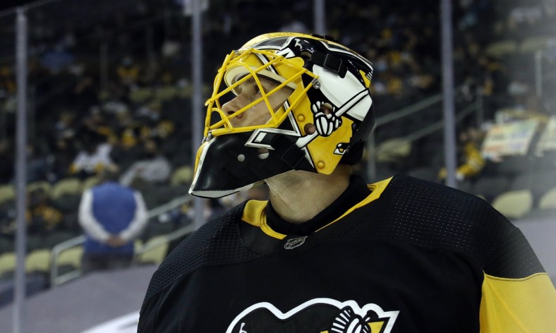 Apr 24, 2021; Pittsburgh, Pennsylvania, USA;  Pittsburgh Penguins goaltender Casey DeSmith (1) glances at the scoreboard against the New Jersey Devils during the second period at PPG Paints Arena. The Penguins won 4-2. Mandatory Credit: Charles LeClaire-USA TODAY Sports