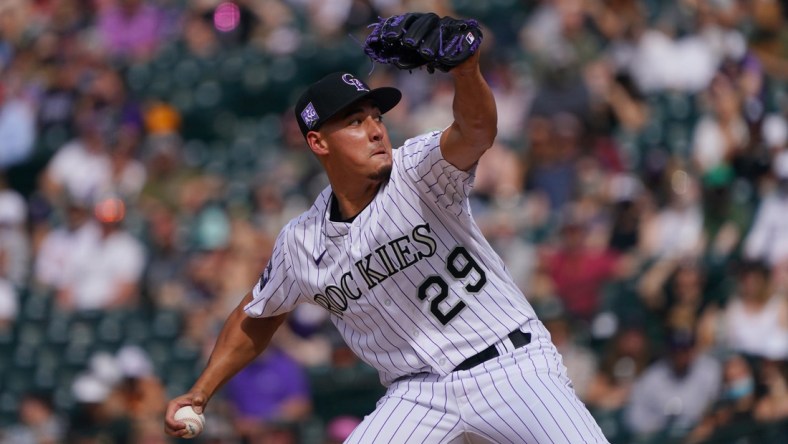 Apr 25, 2021; Denver, Colorado, USA; Colorado Rockies relief pitcher Robert Stephenson (29) delivers a pitch in the eighth inning at against the Philadelphia Phillies at Coors Field. Mandatory Credit: Ron Chenoy-USA TODAY Sports