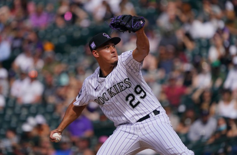 Apr 25, 2021; Denver, Colorado, USA; Colorado Rockies relief pitcher Robert Stephenson (29) delivers a pitch in the eighth inning at against the Philadelphia Phillies at Coors Field. Mandatory Credit: Ron Chenoy-USA TODAY Sports