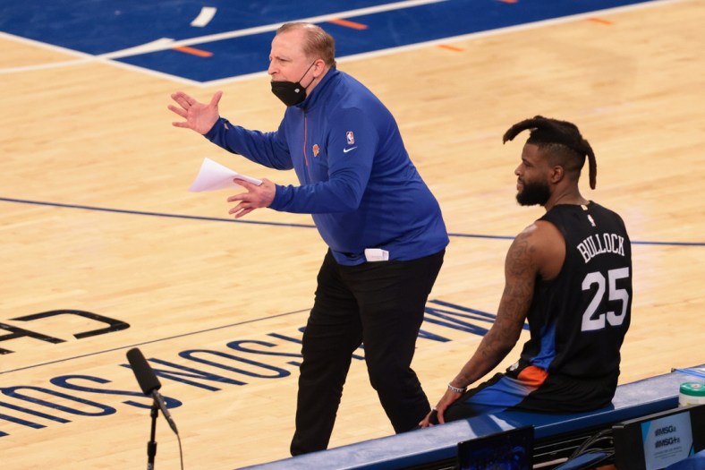 Apr 28, 2021; New York, New York, USA; New York Knicks head coach Tom Thibodeau  reacts during the second quarter against the Chicago Bulls in front of forward Reggie Bullock (25) at Madison Square Garden. Mandatory Credit: Vincent Carchietta-USA TODAY Sports