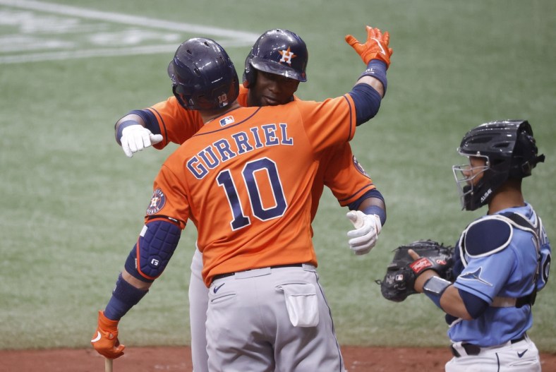May 2, 2021; St. Petersburg, Florida, USA;  Houston Astros left fielder Yordan Alvarez (44) is congratulated by first baseman Yuli Gurriel (10) hits a home run during the fourth inning against the Tampa Bay Rays at Tropicana Field. Mandatory Credit: Kim Klement-USA TODAY Sports