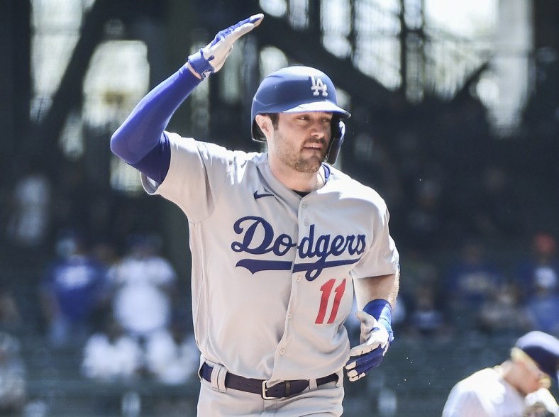 May 2, 2021; Milwaukee, Wisconsin, USA; Los Angeles Dodgers left fielder AJ Pollock (11) reacts as he runs the bases after hitting a grand slam home run in the first inning against the Milwaukee Brewers at American Family Field. Mandatory Credit: Benny Sieu-USA TODAY Sports