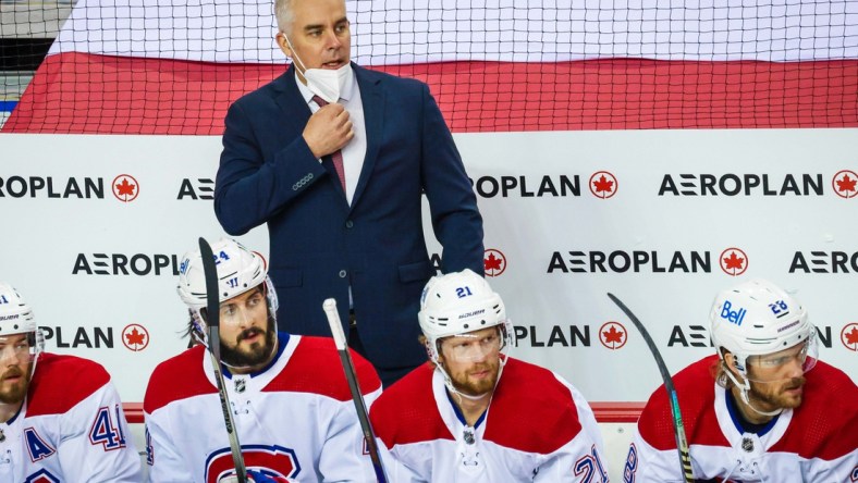 Apr 23, 2021; Calgary, Alberta, CAN; Montreal Canadiens head coach Dominique Ducharme on his bench against the Calgary Flames during the second period at Scotiabank Saddledome. Mandatory Credit: Sergei Belski-USA TODAY Sports