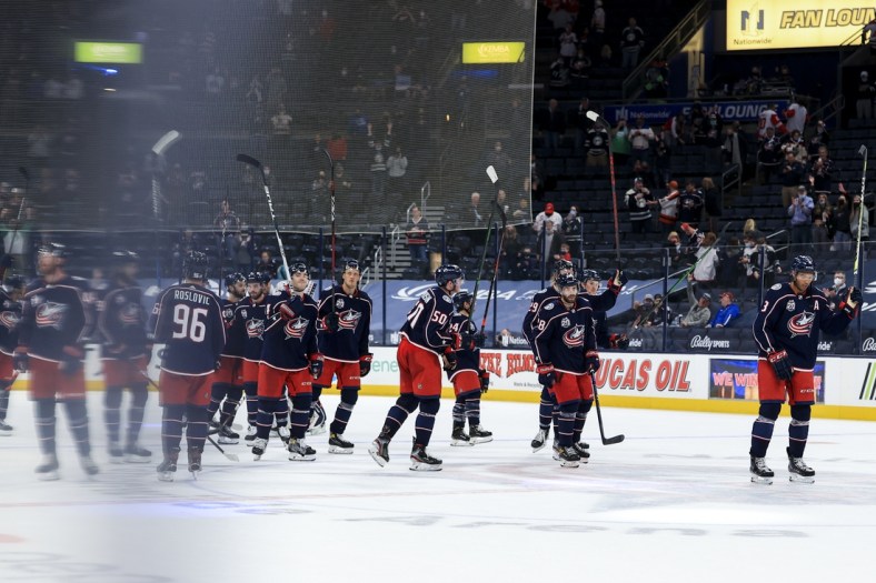 May 8, 2021; Columbus, Ohio, USA; Members of the Columbus Blue Jackets salute fans after defeating the Detroit Red Wings in the overtime period at Nationwide Arena. Mandatory Credit: Aaron Doster-USA TODAY Sports
