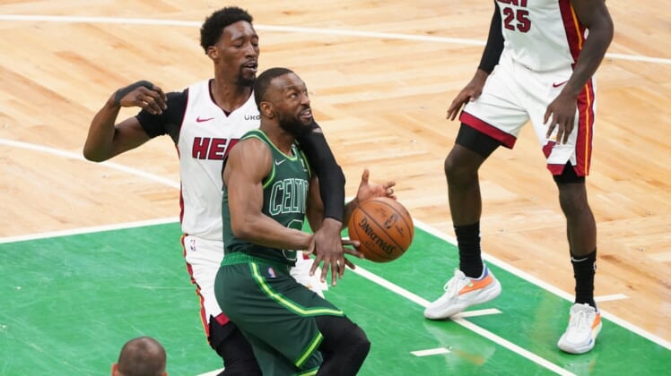 May 11, 2021; Boston, Massachusetts, USA; Miami Heat center Bam Adebayo (13) fouls Boston Celtics guard Kemba Walker (8) in the third quarter at TD Garden. Mandatory Credit: David Butler II-USA TODAY Sports