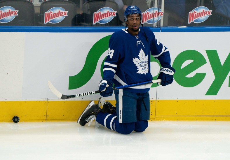 May 6, 2021; Toronto, Ontario, CAN; Toronto Maple Leafs right wing Wayne Simmonds (24) stretches during the warm-up against the Montreal Canadiens at Scotiabank Arena. Mandatory Credit: Nick Turchiaro-USA TODAY Sports