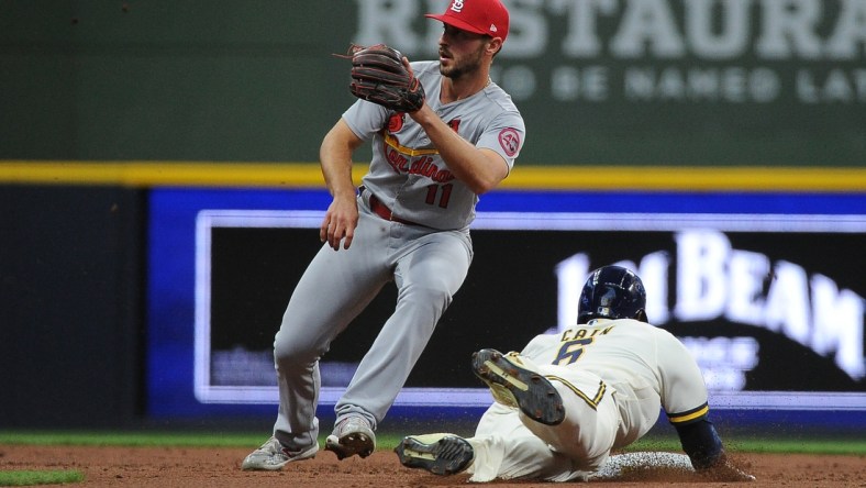 May 12, 2021; Milwaukee, Wisconsin, Milwaukee Brewers center fielder Lorenzo Cain (6) steals second base ahead of the tag of St. Louis Cardinals shortstop Paul DeJong (11) in the third inning at American Family Field. Mandatory Credit: Michael McLoone-USA TODAY Sports