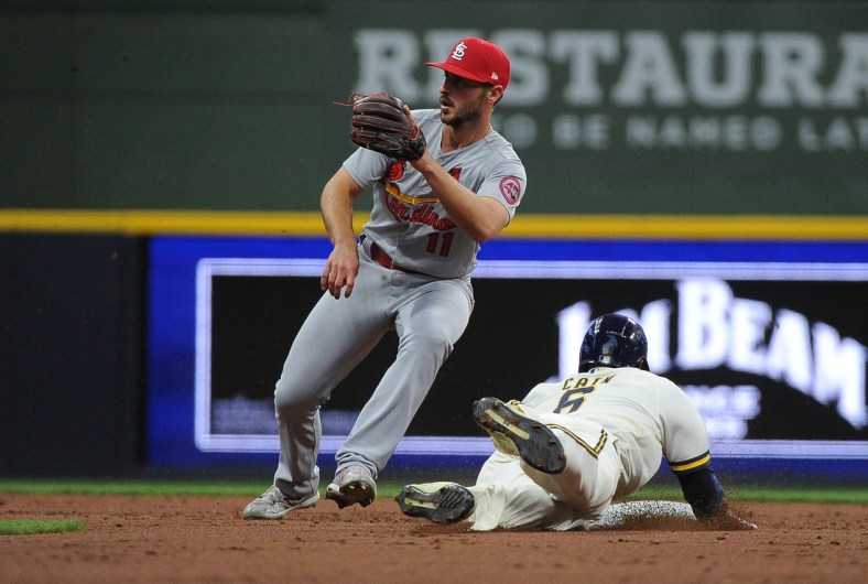May 12, 2021; Milwaukee, Wisconsin, Milwaukee Brewers center fielder Lorenzo Cain (6) steals second base ahead of the tag of St. Louis Cardinals shortstop Paul DeJong (11) in the third inning at American Family Field. Mandatory Credit: Michael McLoone-USA TODAY Sports