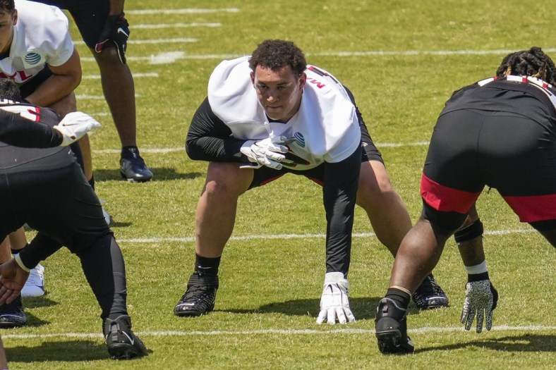 May 14, 2021; Flowery Branch, Georgia, USA;  Atlanta Falcons offensive lineman Jalen Mayfield (77) lines up for a play during rookie camp at the Falcons Training Facility. Mandatory Credit: Dale Zanine-USA TODAY Sports