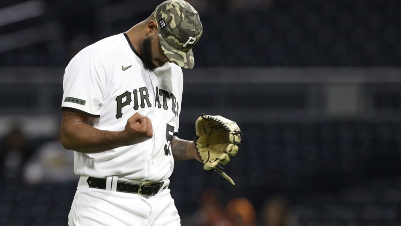 May 14, 2021; Pittsburgh, Pennsylvania, USA; Pittsburgh Pirates relief pitcher Luis Oviedo (57) reacts after pitching the eleventh inning against the San Francisco Giants at PNC Park. The Pirates won 3-2 in eleven innings. Mandatory Credit: Charles LeClaire-USA TODAY Sports