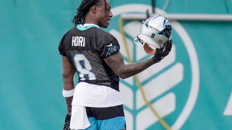 May 15, 2021;Charlotte, North Carolina, USA; First round pick Jaycee Horn (8) looks over his new helmet during Carolina Panthers Rookie Camp at the Atrium Training Facility in Charlotte, NC. Mandatory Credit: Jim Dedmon-USA TODAY Sports