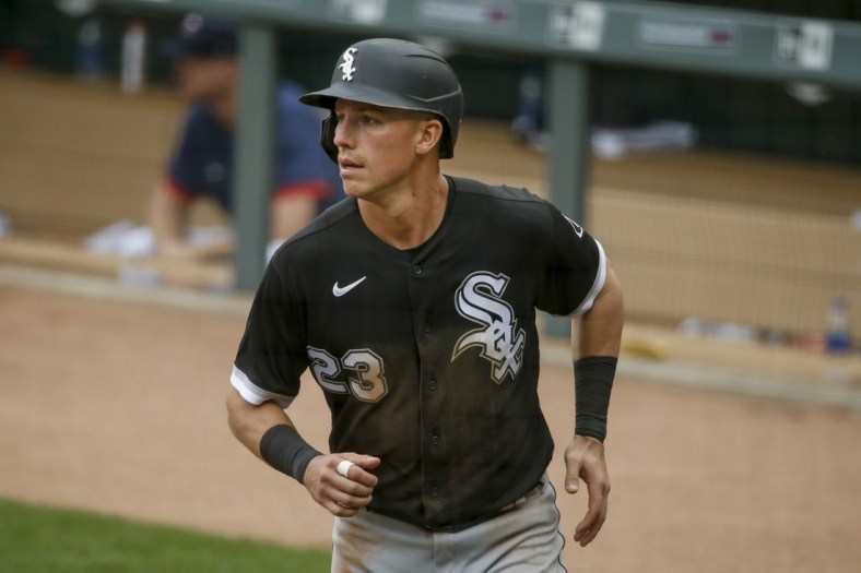 May 19, 2021; Minneapolis, Minnesota, USA; Chicago White Sox left fielder Jake Lamb (23) returns to the dugout after scoring against the Minnesota Twins in the sixth inning at Target Field. Mandatory Credit: Bruce Kluckhohn-USA TODAY Sports