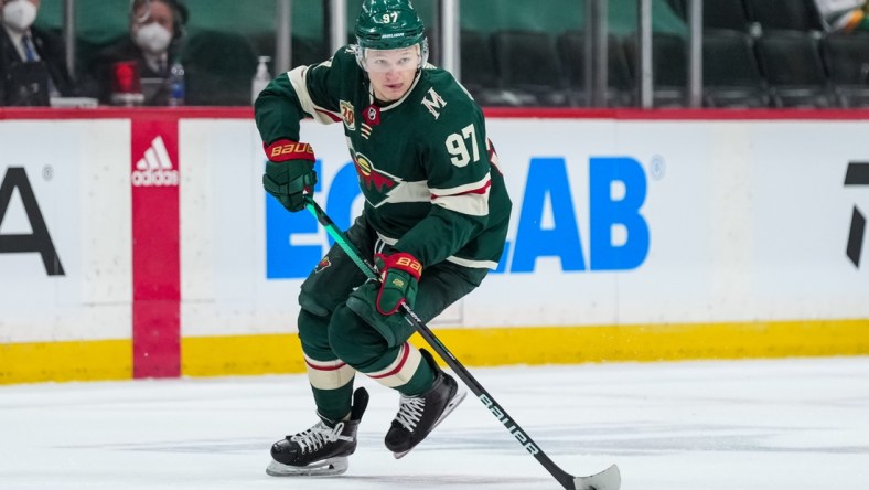 May 20, 2021; Saint Paul, Minnesota, USA; Minnesota Wild forward Kirill Kaprizov (97) carries the puck during the second period in game three of the first round of the 2021 Stanley Cup Playoffs against the Vegas Golden Knights at Xcel Energy Center. Mandatory Credit: Brace Hemmelgarn-USA TODAY Sports