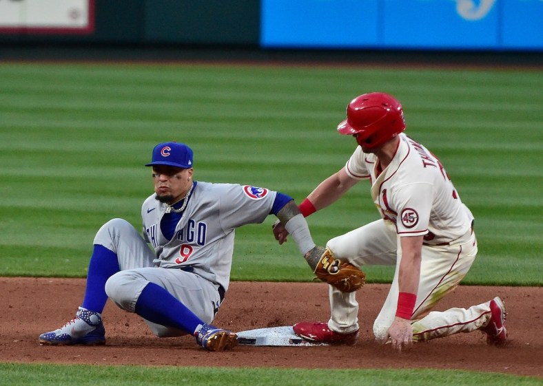 May 22, 2021; St. Louis, Missouri, USA;  St. Louis Cardinals right fielder Lane Thomas (35) steals second as Chicago Cubs shortstop Javier Baez (9) applies the tag late during the fifth inning at Busch Stadium. Mandatory Credit: Jeff Curry-USA TODAY Sports