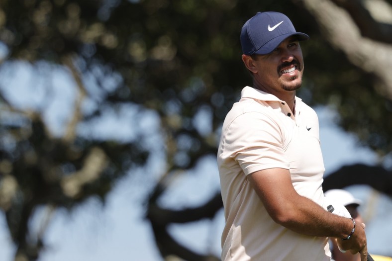 May 23, 2021; Kiawah Island, South Carolina, USA; Brooks Koepka reacts to his tee shot on the seventh hole during the final round of the PGA Championship golf tournament. Mandatory Credit: Geoff Burke-USA TODAY Sports