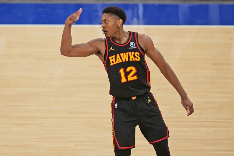 May 23, 2021; New York, New York, USA; Atlanta Hawks forward De'Andre Hunter (12) celebrates a three-point basket against the New York Knicks during the second half in game one in the first round of the 2021 NBA Playoffs at Madison Square Garden. Mandatory Credit: Seth Wenig/Pool Photo-USA TODAY Sports