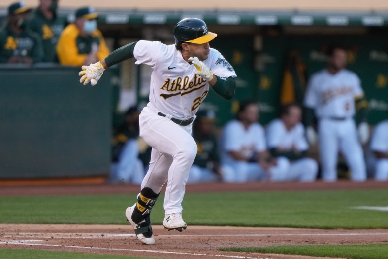 May 24, 2021; Oakland, California, USA; Oakland Athletics center fielder Ramon Laureano (22) runs after hitting a single during the first inning against the Seattle Mariners at RingCentral Coliseum. Mandatory Credit: Stan Szeto-USA TODAY Sports