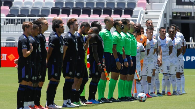 May 22, 2021; Fort Lauderdale, FL, Fort Lauderdale, FL, USA; CF Montreal and FC Cincinnati players listen to the national anthem prior the first half at DRV PNK Stadium. Mandatory Credit: Sam Navarro-USA TODAY Sports