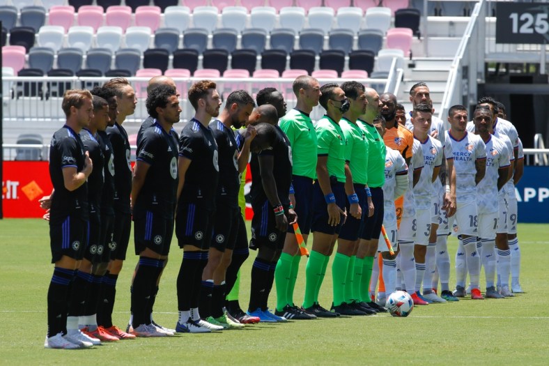 May 22, 2021; Fort Lauderdale, FL, Fort Lauderdale, FL, USA; CF Montreal and FC Cincinnati players listen to the national anthem prior the first half at DRV PNK Stadium. Mandatory Credit: Sam Navarro-USA TODAY Sports