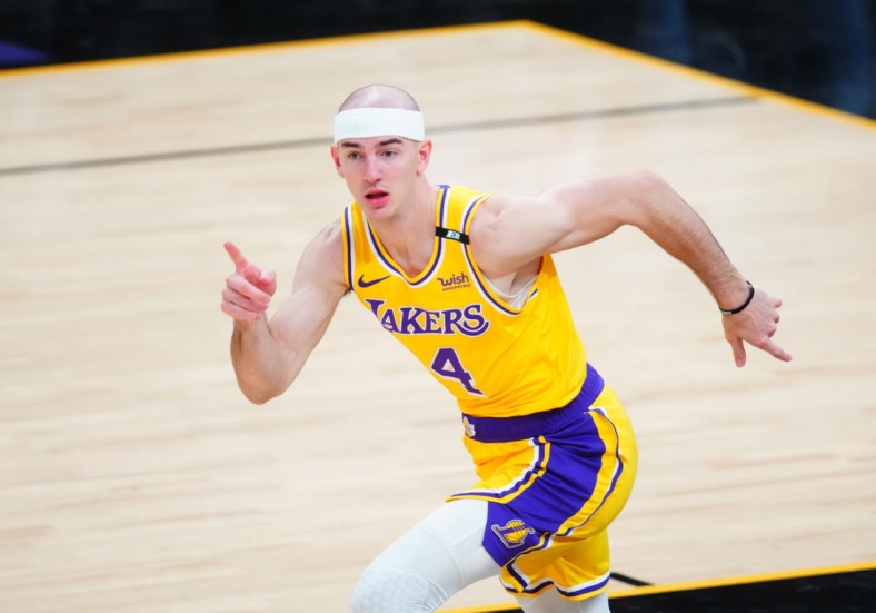 May 25, 2021; Phoenix, Arizona, USA; Los Angeles Lakers guard Alex Caruso (4) reacts against the Phoenix Suns during game two of the first round of the 2021 NBA Playoffs at Phoenix Suns Arena. Mandatory Credit: Mark J. Rebilas-USA TODAY Sports
