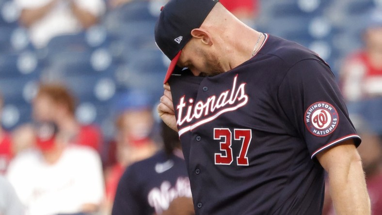 May 27, 2021; Washington, District of Columbia, USA; Washington Nationals starting pitcher Stephen Strasburg (37) wipes his face between batters against the Cincinnati Reds in the first inning at Nationals Park. Mandatory Credit: Geoff Burke-USA TODAY Sports