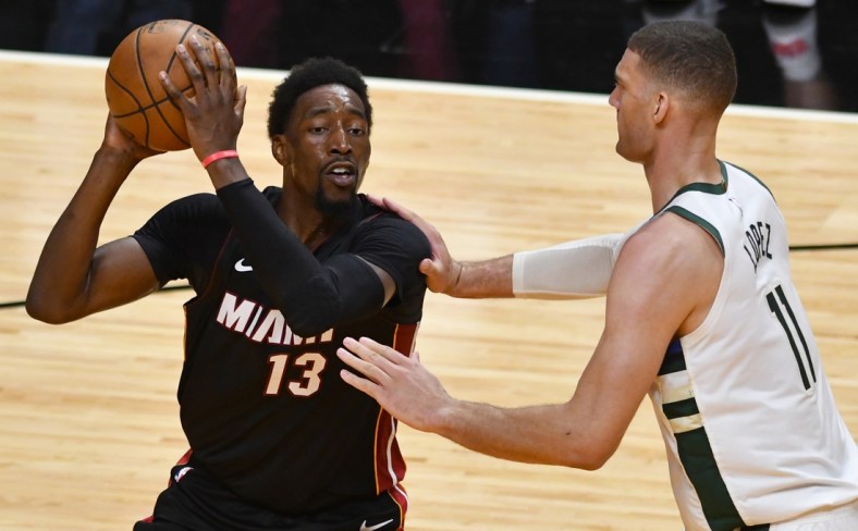 May 27, 2021; Miami, Florida, USA; Milwaukee Bucks center Brook Lopez (11) defends Miami Heat center Bam Adebayo (13) in the first half during game three in the first round of the 2021 NBA Playoffs at American Airlines Arena. Mandatory Credit: Jim Rassol-USA TODAY Sports