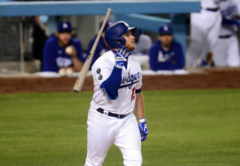 May 27, 2021; Los Angeles, California, USA; Los Angeles Dodgers second baseman Max Muncy (13) reacts after hitting a solo home run against the San Francisco Giants during the sixth inning at Dodger Stadium. Mandatory Credit: Gary A. Vasquez-USA TODAY Sports