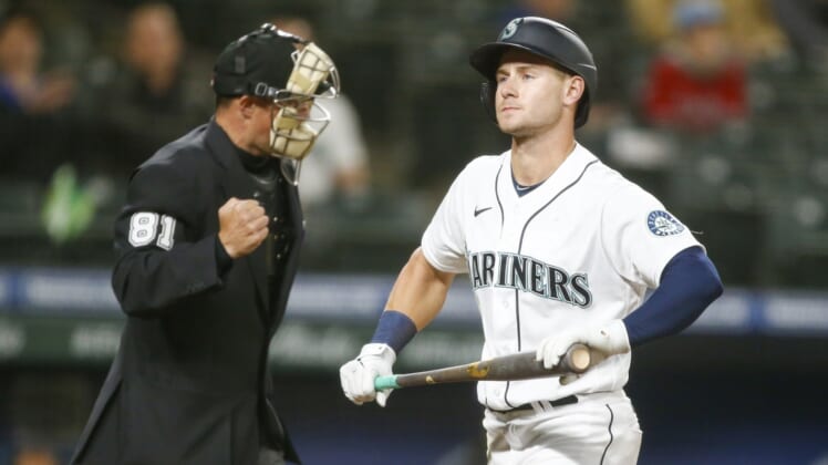 May 27, 2021; Seattle, Washington, USA; Seattle Mariners left fielder Jarred Kelenic (10) returns to the dugout after striking out against the Texas Rangers during the seventh inning at T-Mobile Park. Mandatory Credit: Joe Nicholson-USA TODAY Sports