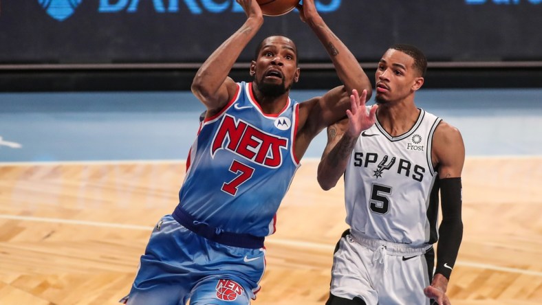 May 12, 2021; Brooklyn, New York, USA; Brooklyn Nets forward Kevin Durant (7) and San Antonio Spurs guard Dejounte Murray (5) at Barclays Center. Mandatory Credit: Wendell Cruz-USA TODAY Sports