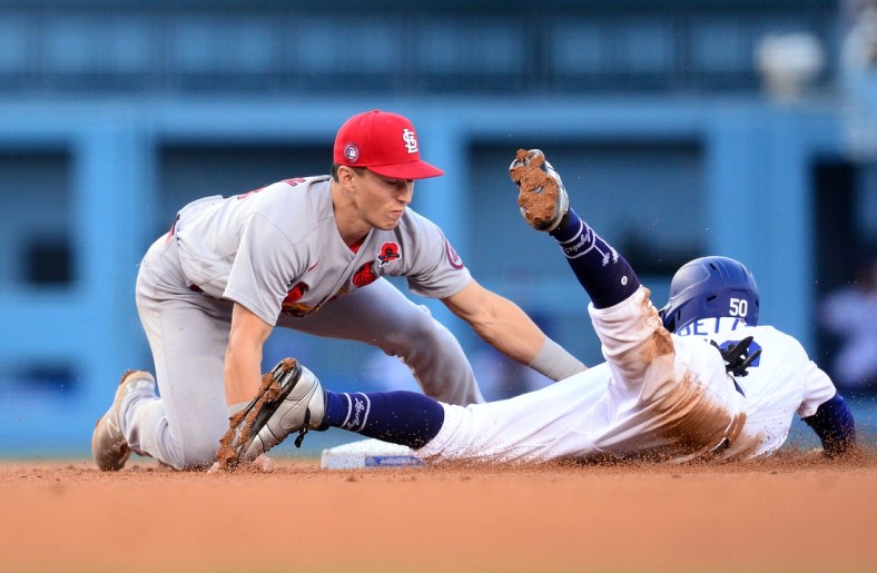 May 31, 2021; Los Angeles, California, USA; Los Angeles Dodgers right fielder Mookie Betts (50) is caught stealing second against St. Louis Cardinals second baseman Tommy Edman (19) to end the third inning at Dodger Stadium. Mandatory Credit: Gary A. Vasquez-USA TODAY Sports