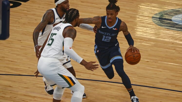 May 31, 2021; Memphis, Tennessee, USA; Memphis Grizzlies guard Ja Morant (12) drives to the basket during the first quarter during game four in the first round of the 2021 NBA Playoffs against the Utah Jazz at FedExForum. Mandatory Credit: Petre Thomas-USA TODAY Sports