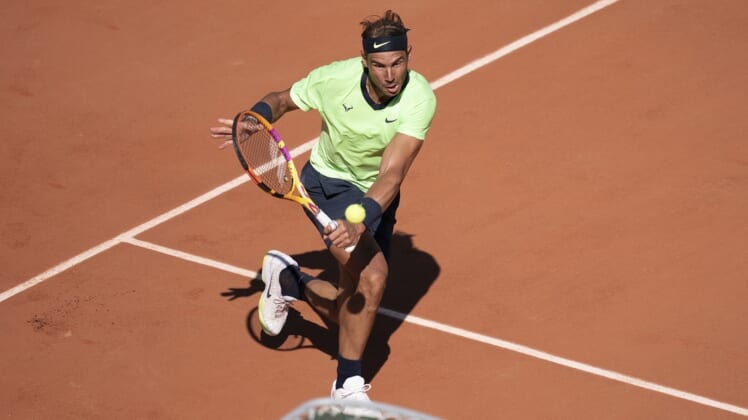 Jun 1, 2021; Paris, France; Rafael Nadal (ESP) in action during his match against Alexei Popyrin (AUS) on day three of the French Open at Roland Garros Stadium. Mandatory Credit: Susan Mullane-USA TODAY Sports