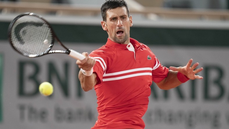 Jun 1, 2021; Paris, France; Novak Djokovic (SRB) in action during his match against Tennys Sandgren (USA) on day three of the French Open at Roland Garros Stadium. Mandatory Credit: Susan Mullane-USA TODAY Sports