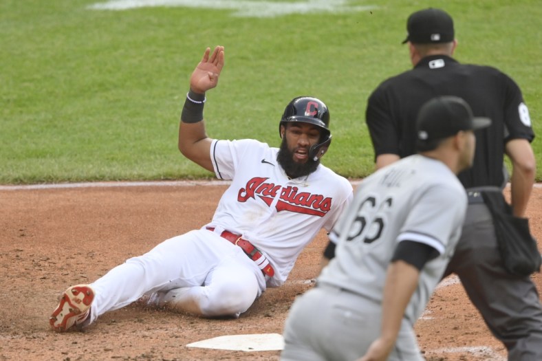 Jun 1, 2021; Cleveland, Ohio, USA; Cleveland Indians shortstop Amed Rosario (1) scores in the fourth inning against the Chicago White Sox at Progressive Field. Mandatory Credit: David Richard-USA TODAY Sports