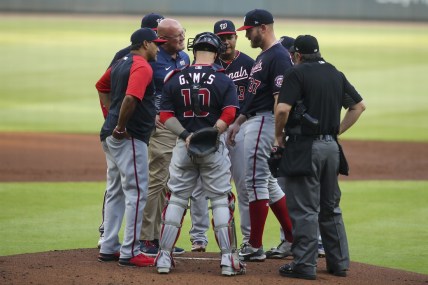 Jun 1, 2021; Atlanta, Georgia, USA; Washington Nationals starting pitcher Stephen Strasburg (37) is looked at by trainer Paul Lessard after a pitch against the Atlanta Braves in the first inning at Truist Park. Mandatory Credit: Brett Davis-USA TODAY Sports