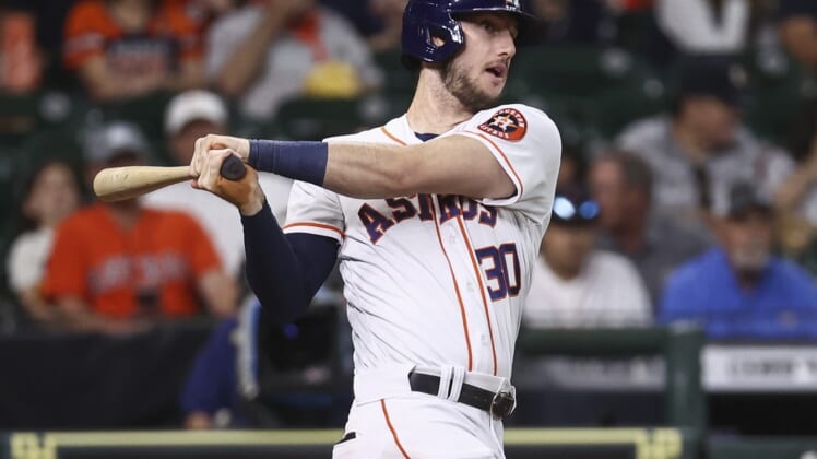 Jun 1, 2021; Houston, Texas, USA; Houston Astros right fielder Kyle Tucker (30) hits a double during the second inning against the Boston Red Sox at Minute Maid Park. Mandatory Credit: Troy Taormina-USA TODAY Sports