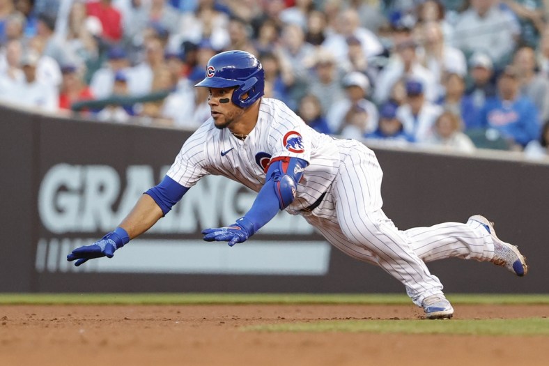 Jun 1, 2021; Chicago, Illinois, USA; Chicago Cubs catcher Willson Contreras (40) slides to second base after hitting a double against the San Diego Padres during the third inning at Wrigley Field. Mandatory Credit: Kamil Krzaczynski-USA TODAY Sports